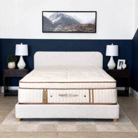 Organic Meadow hybrid Plush organic mattress on a bed frame.