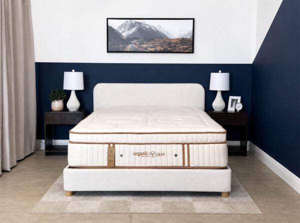 Organic Meadow hybrid Plush organic mattress on a bed frame.