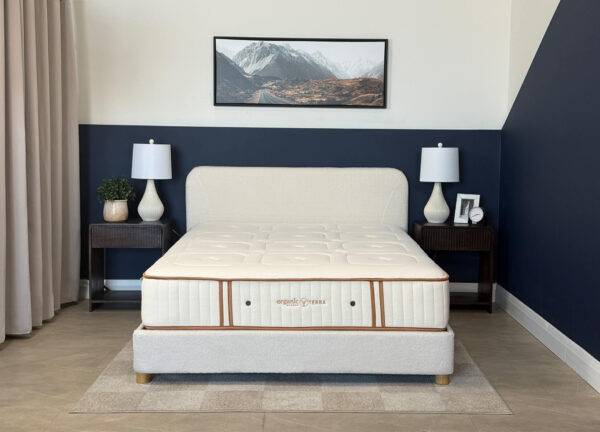 Organic Meadow hybrid firm organic mattress on a bed frame.