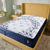 Stearns & Foster Estate Pillowtop Luxury Cushion Firm Mon Cheri Mattress on a sand colored bed frame