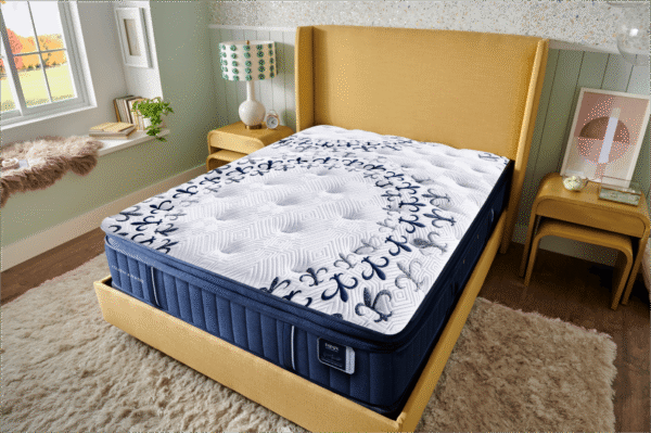 Stearns & Foster Estate Pillowtop Luxury Cushion Firm Mon Cheri Mattress on a sand colored bed frame