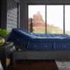 A Stearns and Foster Lux Estate Marcela mattress flexing perfectly while elevated on an adjustable power base in a modern bedroom setting.