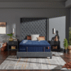 Elegant master bedroom featuring a Stearns and Foster Lux Estate Marcela mattress on a modern frame with large windows overlooking a scenic desert background.