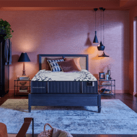 Stearns & Foster Estate Tight Top Luxury Firm Mon Trésor mattress displayed on a modern bed frame inside a luxury contemporary bedroom.