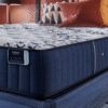 Close-up of the Stearns & Foster Estate Tight Top Luxury Firm Mon Trésor mattress showing the quilted surface, Estate Collection label, and premium side upholstery.