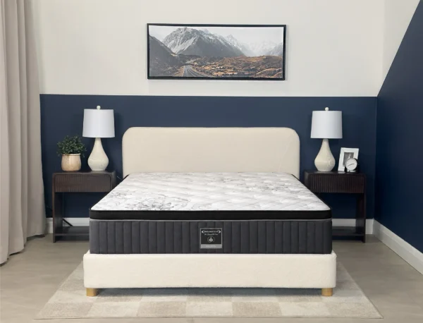 Dreamstar Hilton Euro-Top 13″ mattress on an upholstered bed in a navy bedroom