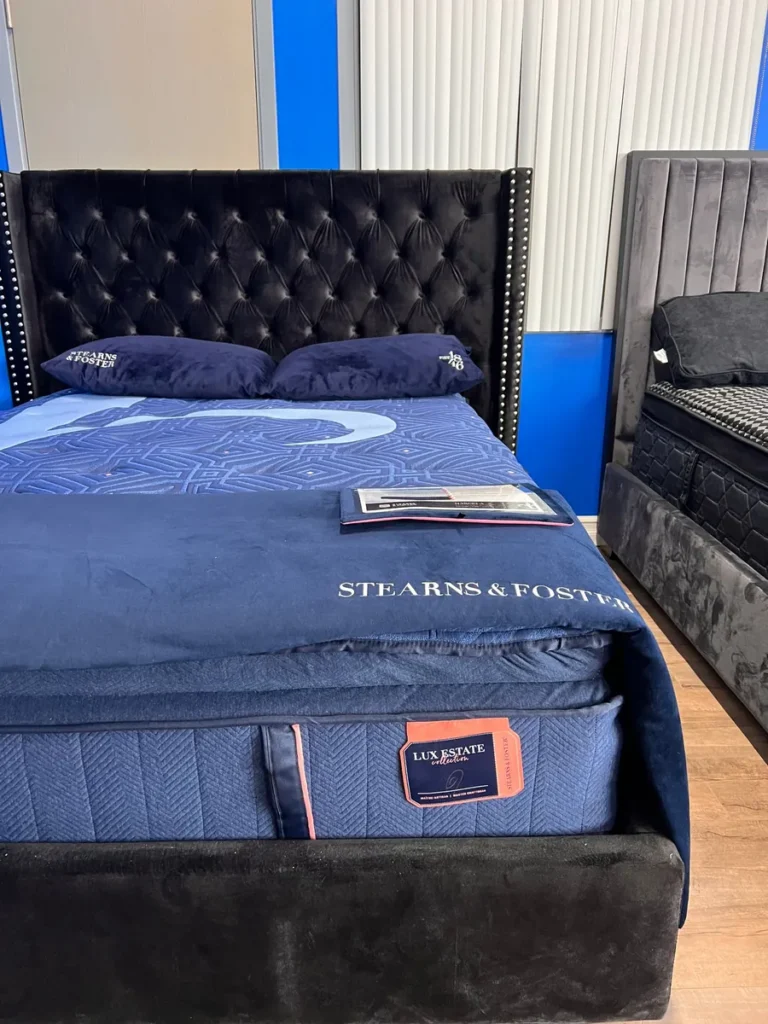 Stearns & Foster Lux Estate mattress on a tufted bed frame at the Sleep Masters North York showroom